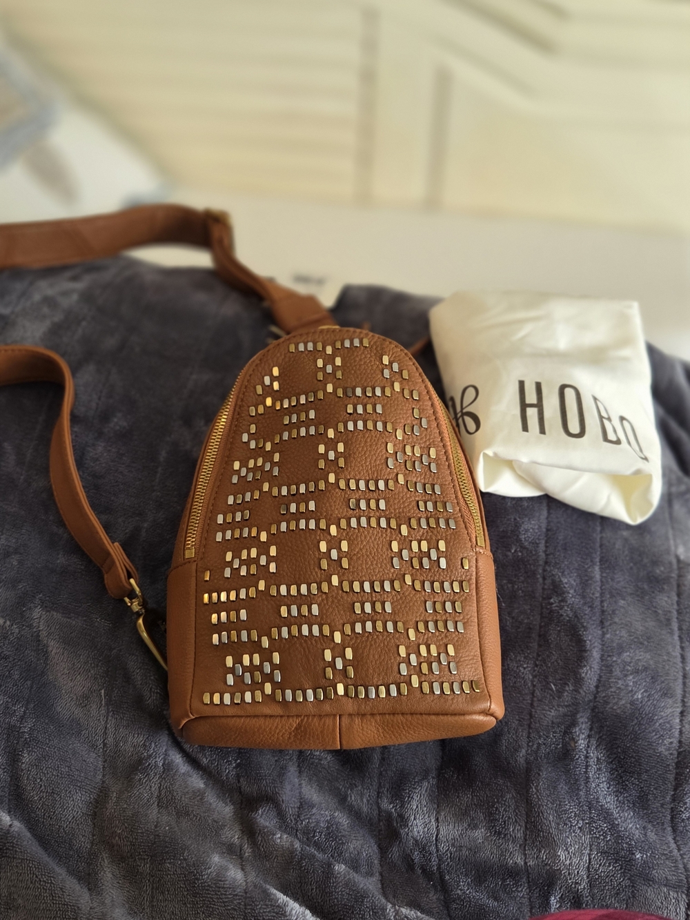 HOBO Brown Leather Studded Sling Backpack with Gold Accents